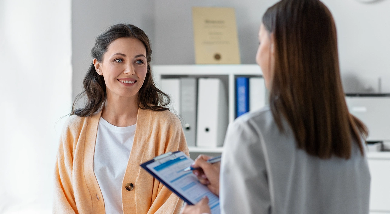 Woman speaking with doctor